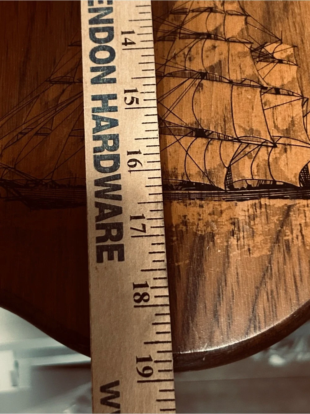 Bulova wall clock features a unique wooden casing shaped like a stylized ship
